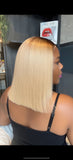 Woman with a blonde wig in a salon setting