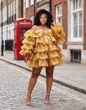 Gold off-shoulder tiered ruffle mini dress with voluminous layered design
