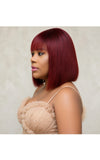 Woman with burgundy bone straight fringe wig