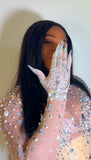 Close-up of embellished glove with rhinestone detailing and statement design