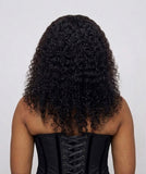 Back view of kinky curly human hair wig showing full volume curls