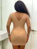 Back view of nude rhinestone mesh mini dress showing fitted silhouette and zip closure