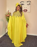 Yellow gold embellished kaftan abaya with flowing silhouette and matching scarf for elegant modest fashion